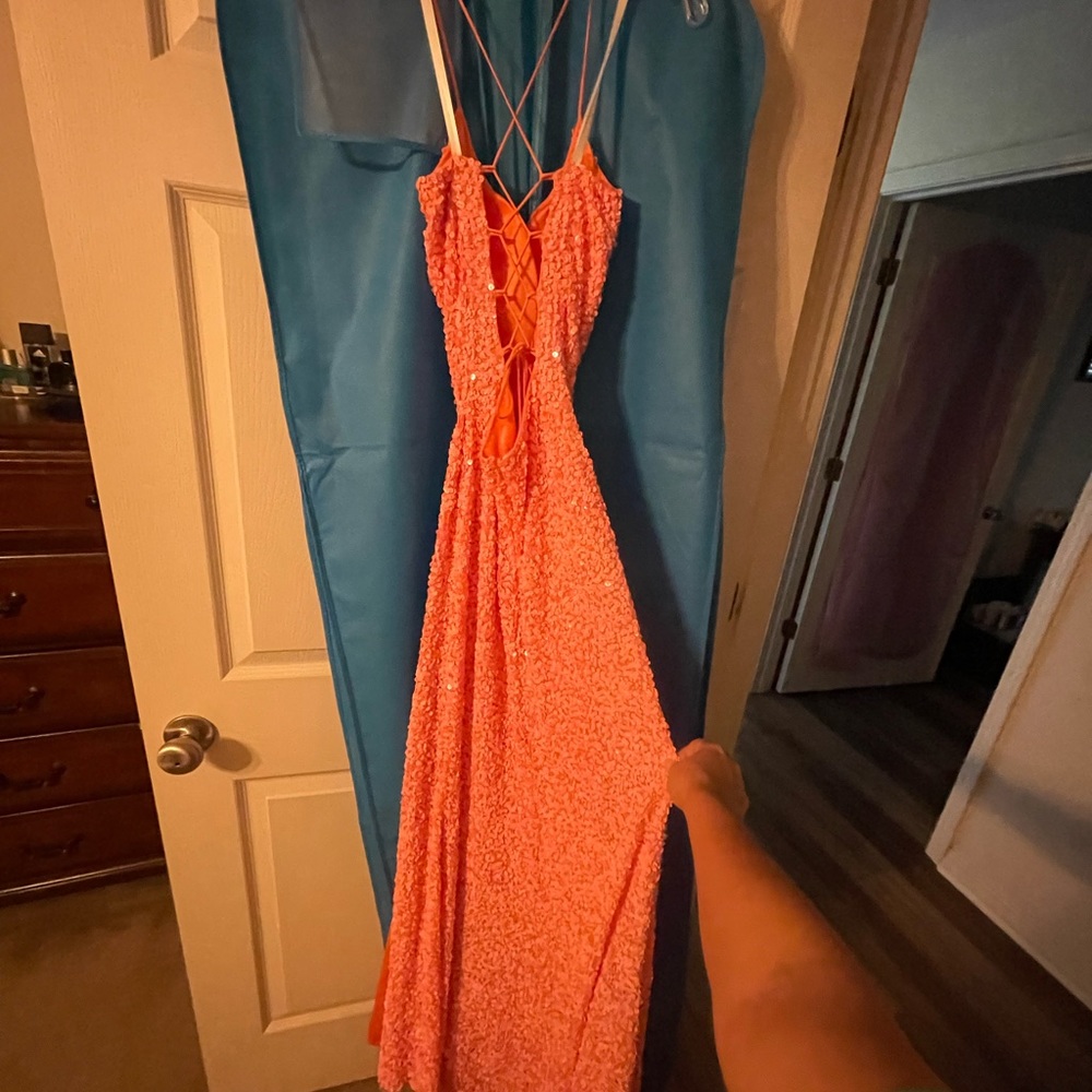 Pink/peach colored dress, not sure what brand! Size 10. Paid 300.